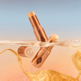 Кремовый хайлайтер в стике Charlotte Tilbury Unreal Highlighter - Glazed Goddess Universal Shade