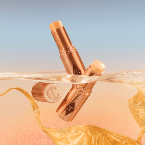 Кремовый хайлайтер в стике Charlotte Tilbury Unreal Highlighter - Glazed Goddess Universal Shade